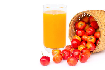 Glass of Acerola cherry juice on white.