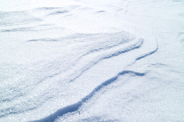 Fototapeta na wymiar snowy bumps on a dune surface on a winter day