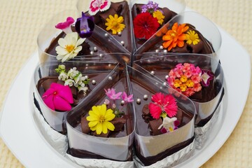 The chocolate cakes with edible flowers.