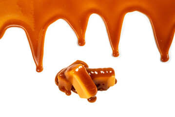 Background of flowing caramel sauce isolated on white.