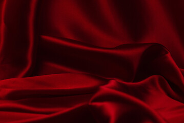 Red silk or satin luxury fabric texture can use as abstract background.