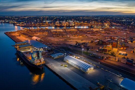 Melbourne Australia June 17th 2019 : Aerial View Of The Port Of Melbourne Industrial Area With Container Ships At Dusk