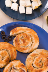 Pastry swirls with cheese and olive filling.
