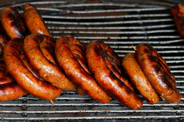 Sai Aua northern Thai spicy sausage on stove.