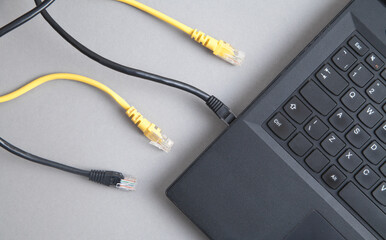 Internet cables and laptop. Internet. Technology
