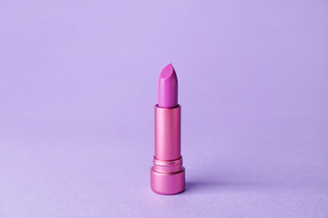 Beautiful lipstick on color background