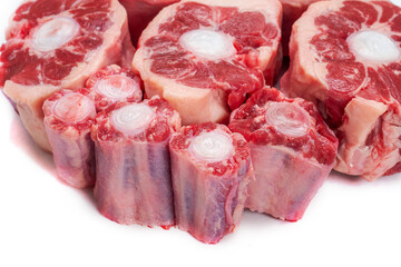 Ox tail portions on a white background, Close up. Meat industry concept.