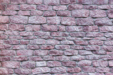 A wall of pink stone. The old wall.