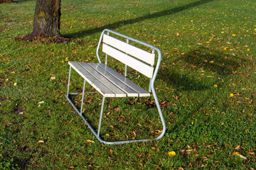 empty bench in city park lawn