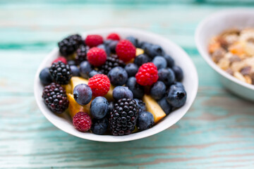 Fresh berries in a bowl. Healthy diet.