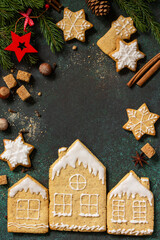 Christmas pastries. Gingerbread cookies on a background of stone or slate. Top view flat lay background. Copy space.