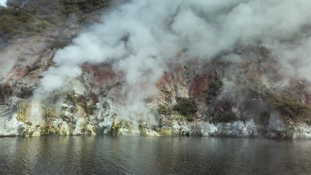 Panning Shot Of Steaming Sulphur Vents At Geothermal Natural Lake Rotomahana Near Rotorua In North Island Of New Zealand, Home Of The Pink And White Terraces, The Original Tourism Attraction Of NZ