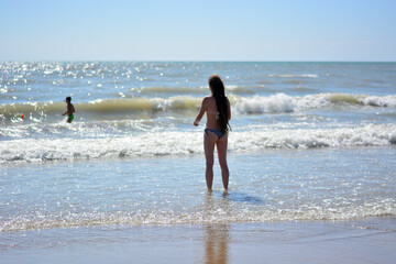 parent and child have fun on the beach