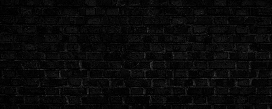 dark, dirty, rough-textured black brick background