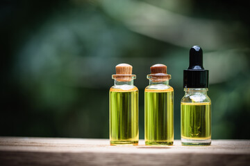 Glass bottles containing  hemp oil,  drugs extracted CBD Cannabis Oil  of researchers or medical team. Herbal alternative medicine.