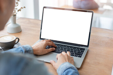 computer mockup blank screen.hand woman work using laptop with white background for advertising,contact business search information on desk at coffee shop.marketing and creative design