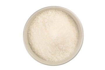 Top view of refined granulated sugar in a white ceramic bowl on white background with clipping path.