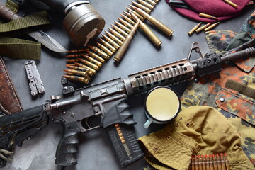 Assault rifle (M4A1)  with ammunition on camouflage uniform,and military equipment for army,bullets...