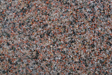 textural plaster of the house wall, colored granite chips, background