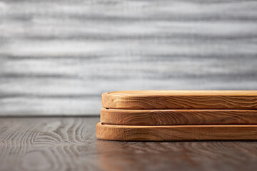 Side view of three wooden cutting boards