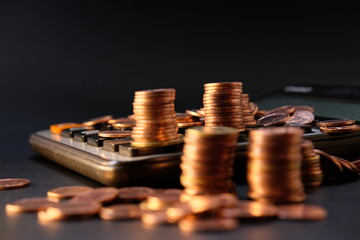 Stack of golden coins on black background and Advertising coins of finance and banking

