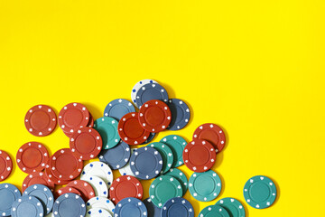 poker chips on yellow background