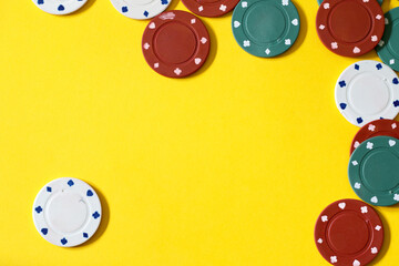 poker chips on yellow background