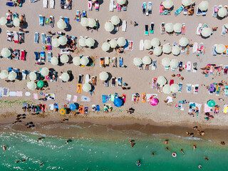 Aerial Beach Drone Photography, People And Umbrellas On Sea Beach
