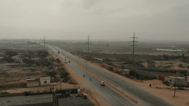 Light Traffic Travelling On Karachi to Hyderabad Motorway. Aerial Follow Shot