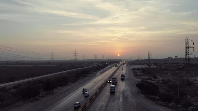 Aerial View Of Traffic Travelling On Karachi to Hyderabad Motorway During Sunset.