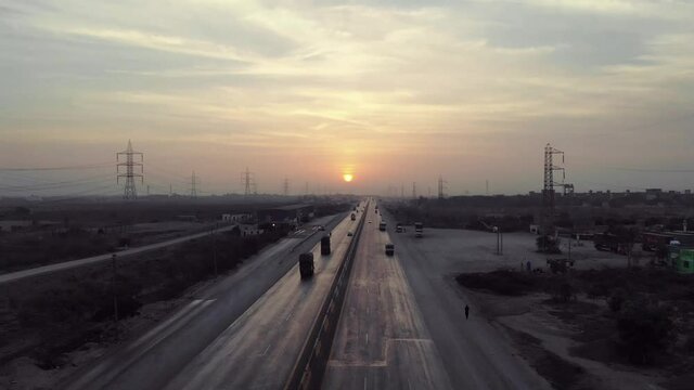 Traffic Travelling On Karachi to Hyderabad Motorway During Sunset. Aerial