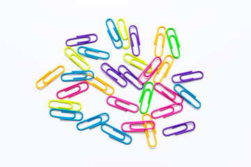 colored paper clips on a white background