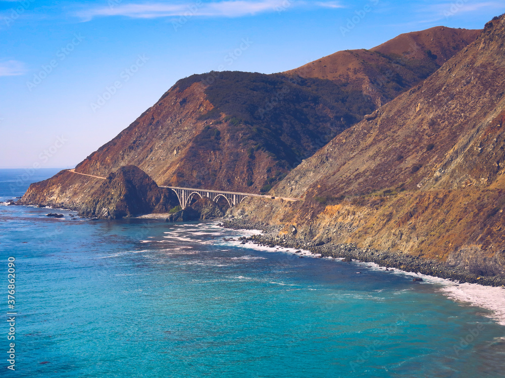 Wall mural Amazing coastline view on Pacific Coast Highway #1 at the US West Coast traveling south to Los Angeles, Big Sur Area, California. Bixby Bridge, Highway #1 Big Sur - California USA.