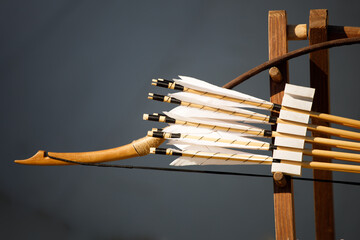 bow with arrows on a gray background. close-up