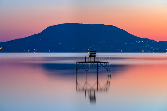 quite morning sunrise at lake balaton in hungary. view of mountain Badacsonyi Badacsony and fishing post
