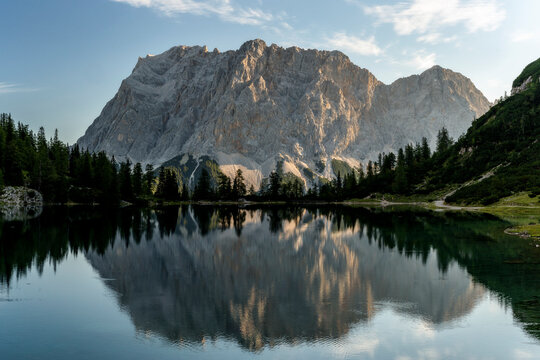 Mountain Zugspitze at sunrise with reflections on lake Seebensee near Ehrwald, reutte, Tirol. Beautiful morning, hiking, mount