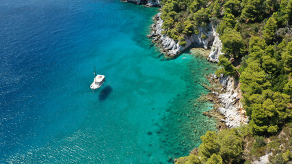 Aerial drone photo of beautiful cave with crystal clear turquoise sea in island of Skopelos visited by boat, Sporades, Greece