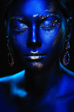 Portrait of a beautiful girl with an exquisite fantasy makeup in the style of legends about ancient greece and pharaohs