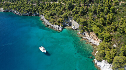 Fototapeta na wymiar Aerial drone photo of beautiful cave with crystal clear turquoise sea in island of Skopelos visited by boat, Sporades, Greece