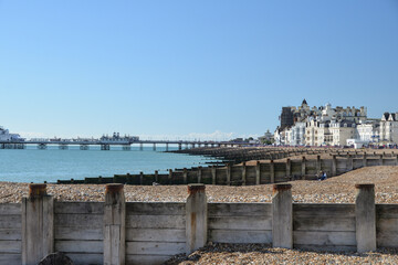 Breakwaters, shingles beach and the pier in Eastbourne, West Sussex, England, UK