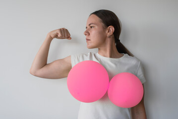 Woman with balloons on her breasts