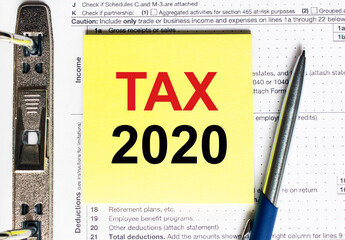 Yellow paper with text Tax 2020