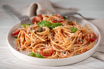 spaghetti with tomato sauce, basil and parmesan