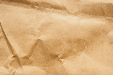 Brown crumpled paper recycled kraft sheet texture background
