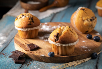 Fresh cupcakes on a wooden table