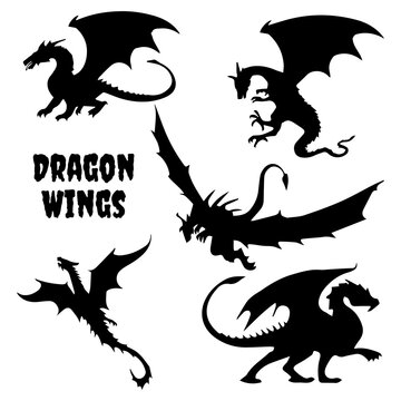 Black stylized vector illustrations of dragons silhouettes
