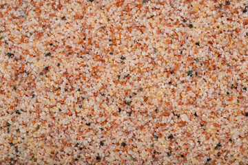 textural plaster of the house wall, colored granite chips, background