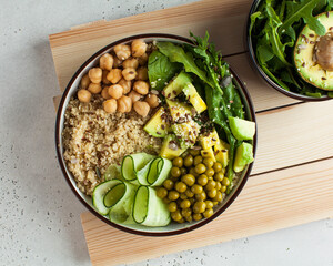 Healthy vegetable lunch from the Buddha bowl with quinoa, avocado, chickpeas. healthy food dish for vegetarians.