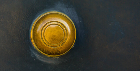 Closeup on a round door handle with decorative elements, door decoration