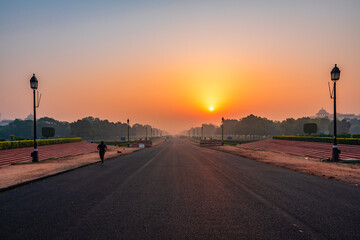 View at sunrise from rajpath 'King's Way' is a ceremonial boulevard in New Delhi, India that runs from Rashtrapati Bhavan on Raisina Hill through Vijay Chowk and India Gate